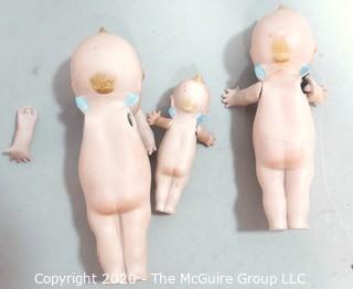 Three Porcelain or Bisque Kewpie Dolls with Frozen Standing Legs.