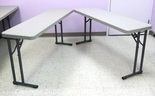 Set of (2) Industrial Heavy Duty Plastic Folding Tables Made by National Public Seating.   There are four lots of these tables for a total of 8 tables .  Each measure approximately 18" W, 30" T  & 60" long.  Room 20 Kitchen