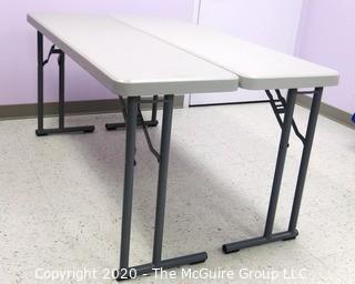 Set of (2) Industrial Heavy Duty Plastic Folding Tables Made by National Public Seating.   There are four lots of these tables for a total of 8 tables .  Each measure approximately 18" W, 30" T  & 60" long.  Room 20 Kitchen