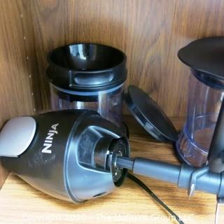 Wood Book Shelf Full of Cleaning & Entertaining Items Including Several Blenders, and Cookware.  Room 20 Kitchen