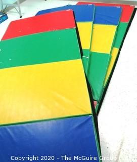 Four lots - One Photo
One (1)48" x 120" Rainbow Folding Tumbling Mat - Room 15