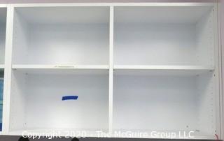 White Laminated Floating Wall Shelf Unit with  Four Compartments and Adjustable Shelves.  Each section measures approximately 46 1/2" x 30" x  14". DISASSEMBLY REQUIRED -  Room 1