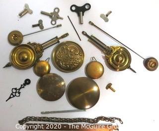 Group of Clock Replacement Parts Including Pendulums, Keys Etc. 