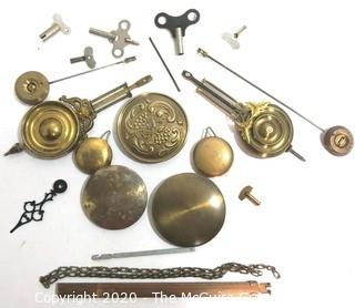 Group of Clock Replacement Parts Including Pendulums, Keys Etc. 