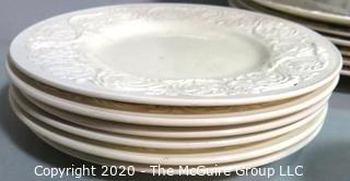 Set of Wedgwood of Etruria & Barlaston Porcelain Fine China Dinnerware set in Patrician Pattern. Cream Color with Embossed Flowers & Scrolls.