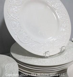 Set of Wedgwood of Etruria & Barlaston Porcelain Fine China Dinnerware set in Patrician Pattern. Cream Color with Embossed Flowers & Scrolls.