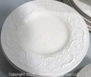 Set of Wedgwood of Etruria & Barlaston Porcelain Fine China Dinnerware set in Patrician Pattern. Cream Color with Embossed Flowers & Scrolls.