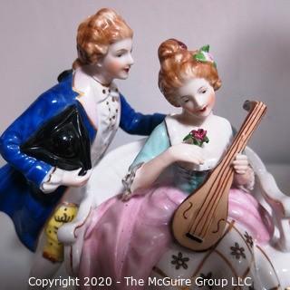 Fine Porcelain Hand Painted Figure of Couple Playing Lute.  Measures approximately 7" tall
