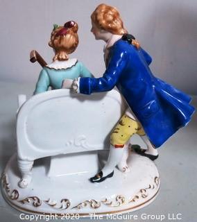 Fine Porcelain Hand Painted Figure of Couple Playing Lute.  Measures approximately 7" tall
