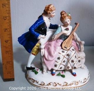 Fine Porcelain Hand Painted Figure of Couple Playing Lute.  Measures approximately 7" tall
