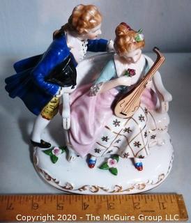 Fine Porcelain Hand Painted Figure of Couple Playing Lute.  Measures approximately 7" tall
