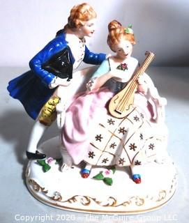 Fine Porcelain Hand Painted Figure of Couple Playing Lute.  Measures approximately 7" tall
