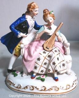 Fine Porcelain Hand Painted Figure of Couple Playing Lute.  Measures approximately 7" tall
