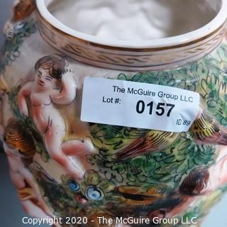 Vintage Porcelain Hand Painted Italian Capodimonte Urn with Lid and Handles with Frolicking Figurals & Cherubs.  Measures approximately 17" tall with lid. 
