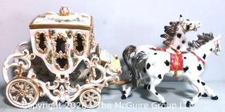 Vintage Porcelain Hand Painted Italian Capodimonte Horse & Carriage with Lidded Container.  Horses have a repair and one missing foot.  Measures approximately 14" tall with lid and 30" long. 
