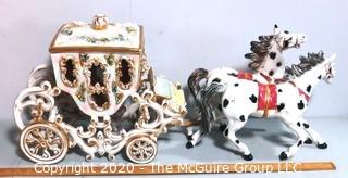 Vintage Porcelain Hand Painted Italian Capodimonte Horse & Carriage with Lidded Container.  Horses have a repair and one missing foot.  Measures approximately 14" tall with lid and 30" long. 
