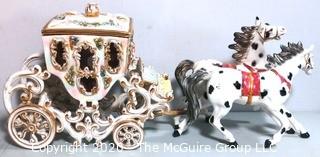 Vintage Porcelain Hand Painted Italian Capodimonte Horse & Carriage with Lidded Container.  Horses have a repair and one missing foot.  Measures approximately 14" tall with lid and 30" long. 
