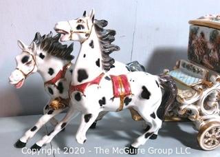 Vintage Porcelain Hand Painted Italian Capodimonte Horse & Carriage with Lidded Container.  Horses have a repair and one missing foot.  Measures approximately 14" tall with lid and 30" long. 
