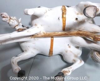 Vintage Porcelain Hand Painted Italian Capodimonte Horse & Carriage with Lidded Container.  Horses have a repair and one missing foot.  Measures approximately 14" tall with lid and 30" long. 
