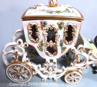 Vintage Porcelain Hand Painted Italian Capodimonte Horse & Carriage with Lidded Container.  Horses have a repair and one missing foot.  Measures approximately 14" tall with lid and 30" long. 
