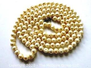 Opera Length Strand of Baroque Freshwater Pearls.   Measures approximately 54" with Sterling Silver Clasp.