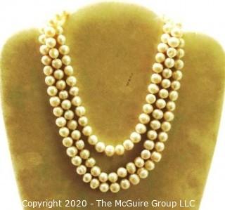 Opera Length Strand of Baroque Freshwater Pearls.   Measures approximately 54" with Sterling Silver Clasp.