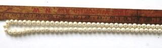 Opera Length Strand of Baroque Freshwater Pearls.   Measures approximately 54" with Sterling Silver Clasp.