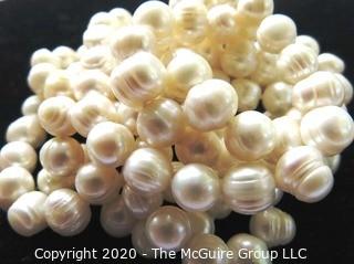 Opera Length Strand of Baroque Freshwater Pearls.   Measures approximately 54" with Sterling Silver Clasp.