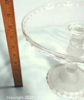 Victorian Pressed Glass Pedestal Cake Stand Three Faces by DUNCAN & MILLER. Measures approximately 10" in diameter with some small flea bites.