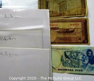 Three Vintage Bank Notes or Currency From Libya, Pakistan & Phillipines