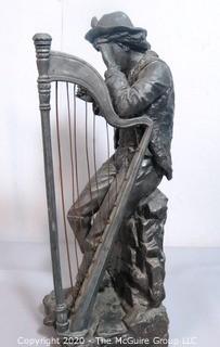 Cast Metal Statue of Boy Playing Harp.  With Repair. Measures Approx 21" x 7"