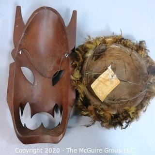 Two Hand Carved African Masks, One with Feathers