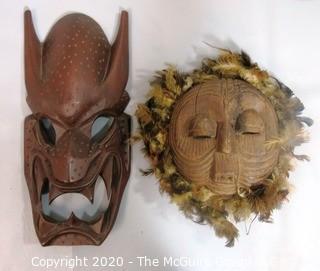 Two Hand Carved African Masks, One with Feathers