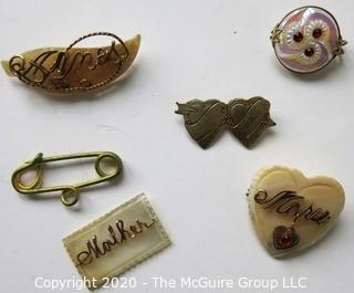 Five Pieces of Vintage Personalized Jewelry.  Four Mother of Pearl with Gold Script One Silver Entwined Hearts.   One piece needs repair. 
