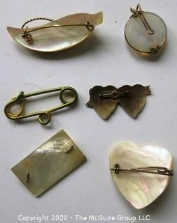 Five Pieces of Vintage Personalized Jewelry.  Four Mother of Pearl with Gold Script One Silver Entwined Hearts.   One piece needs repair. 
