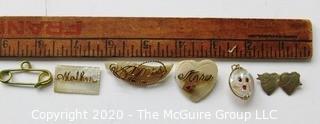 Five Pieces of Vintage Personalized Jewelry.  Four Mother of Pearl with Gold Script One Silver Entwined Hearts.   One piece needs repair. 
