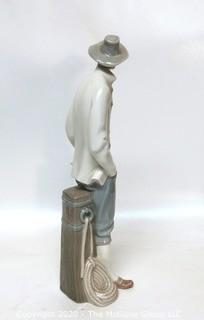 Lladro Porcelain Figurine of Man at Pier.  Small Chip in Hat.