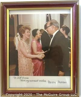 Framed Color Photo of Clifford Evans Greeting the First Lady at Reagan White House reception for Indira Ghandi; signed.    Measures approximately 10" x 15".  US Presidential Political Memorabilia