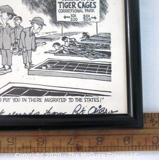 Framed Political Cartoon - Viet Nam POW's by Pat Oliphant for Washington Star. Measures approximately 9" x 7". Signed original art by the artist and dedicated to Clifford Evans. (from the personal collection of Clifford Evans, journalist)

DESCRIPTION UPDATED 10/29/20 AT 3:39 PM