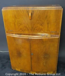 1930's Art Deco: Rivington Cabinet Works (London) Mid Century Dry Bar with Lighted Fold down door and mirrored panels with accessories.  Measures approximately 42"W 31"T 15"D. Vintage Furniture