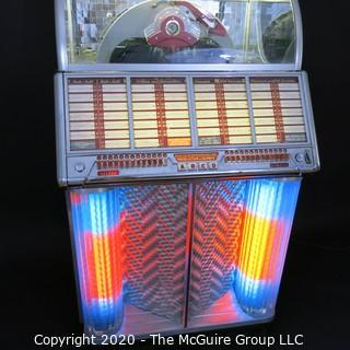 Wurlitzer Jukebox, 1954 Model F-1700, restored with manual and 45 rpm records.  In addition, (2) Matching Art Deco Vintage Wurlitzer Model 5205 Remote Wall Box Table Top Jukeboxes; 12 x 12 7.5"D32"W x 28"D x 56"T