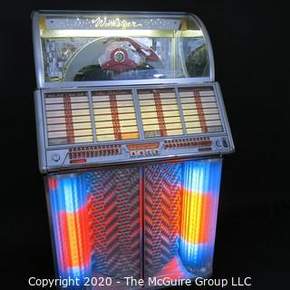 Wurlitzer Jukebox, 1954 Model F-1700, restored with manual and 45 rpm records.  In addition, (2) Matching Art Deco Vintage Wurlitzer Model 5205 Remote Wall Box Table Top Jukeboxes; 12 x 12 7.5"D32"W x 28"D x 56"T