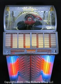 Wurlitzer Jukebox, 1954 Model F-1700, restored with manual and 45 rpm records.  In addition, (2) Matching Art Deco Vintage Wurlitzer Model 5205 Remote Wall Box Table Top Jukeboxes; 12 x 12 7.5"D32"W x 28"D x 56"T