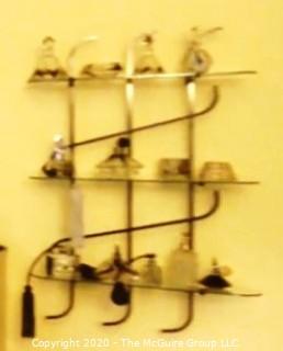 Art Deco Three Shelf Art Deco Iron and Glass Wall Mounted Display Shelf; Originally used as Shoe Display Fixtures in Gimbels Department Store. Includes glass Shelving not shown in photograph. 17"W x 36T x 9.5"D