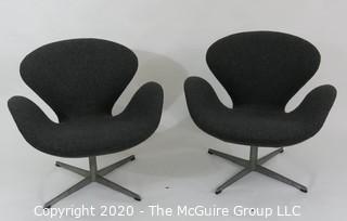 Pair of 1960 Mid Century Modern Arne Jacobson Fritz Hansen Swan Chairs in Charcoal fabric on Chrome Pedestal Base. Label number #0968 with Made in Denmark Stamp on underside. MCM
