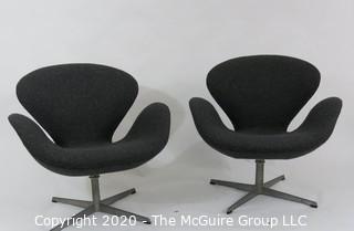 Pair of 1960 Mid Century Modern Arne Jacobson Fritz Hansen Swan Chairs in Charcoal fabric on Chrome Pedestal Base. Label number #0968 with Made in Denmark Stamp on underside. MCM
