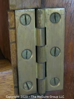 Tall men's dressing cabinet; Art Deco Period Piece with highly figured book-matched veneer front; 33"W  51"T x 19"D.  Vintage. Furniture.