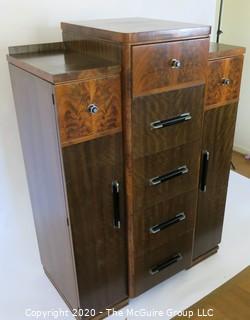 Art Deco Tallboy Dresser Made of Highly Figured Book-Matched Veneer.  5 center drawers flanked by doors (matching pieces to the set are found in Lots 83 and 84) 