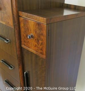 Art Deco Tallboy Dresser Made of Highly Figured Book-Matched Veneer.  5 center drawers flanked by doors (matching pieces to the set are found in Lots 83 and 84) 