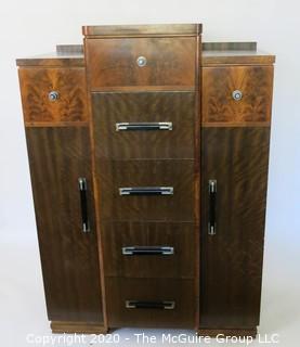 Art Deco Tallboy Dresser Made of Highly Figured Book-Matched Veneer.  5 center drawers flanked by doors (matching pieces to the set are found in Lots 83 and 84) 